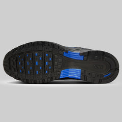 Black and blue athletic trainer bottom pose  on a gray background men's shoes