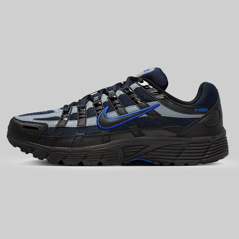 Black and blue athletic trainer on a gray background men's sneaker