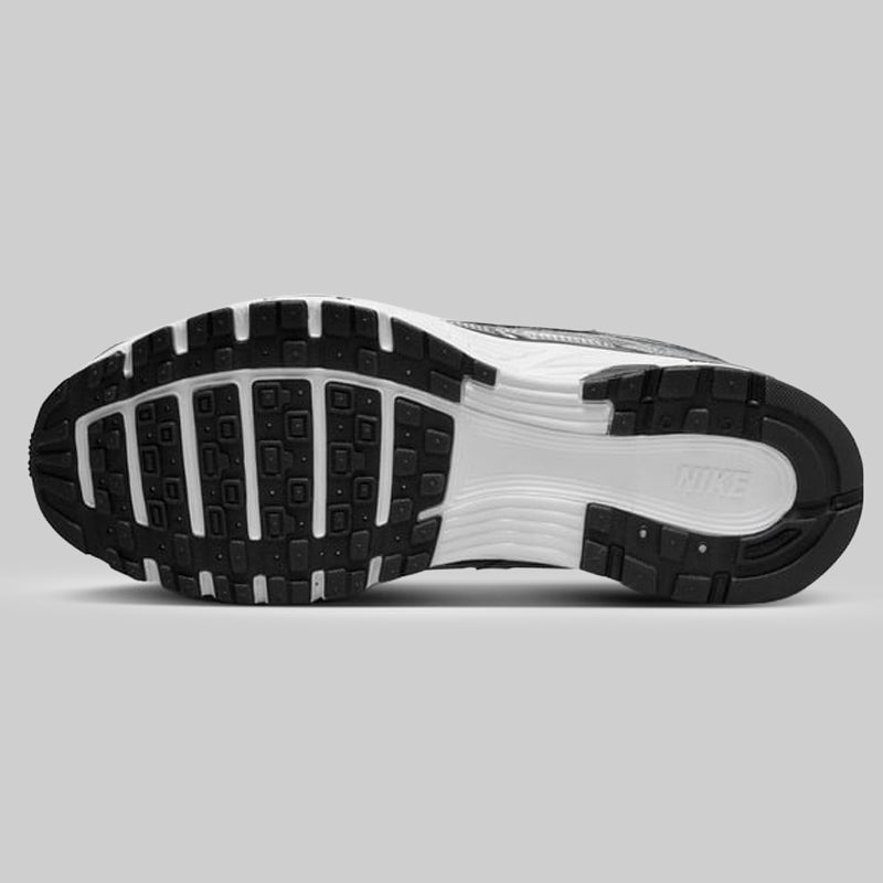 Close-up of a Nike shoe sole on a gray background