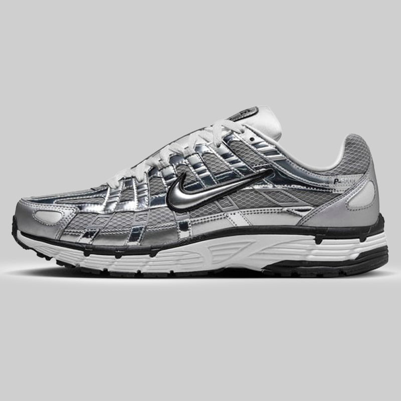 Nike P-6000 Metallic Silver men’s trainers side profile with breathable mesh and retro running design
