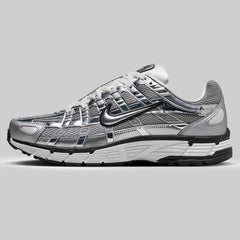 Nike P-6000 Metallic Silver men’s trainers side profile with breathable mesh and retro running design
