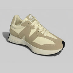 New Balance 327 beige sneakers angled view premium suede lifestyle trainers